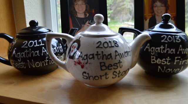 Three Agatha Award teapots